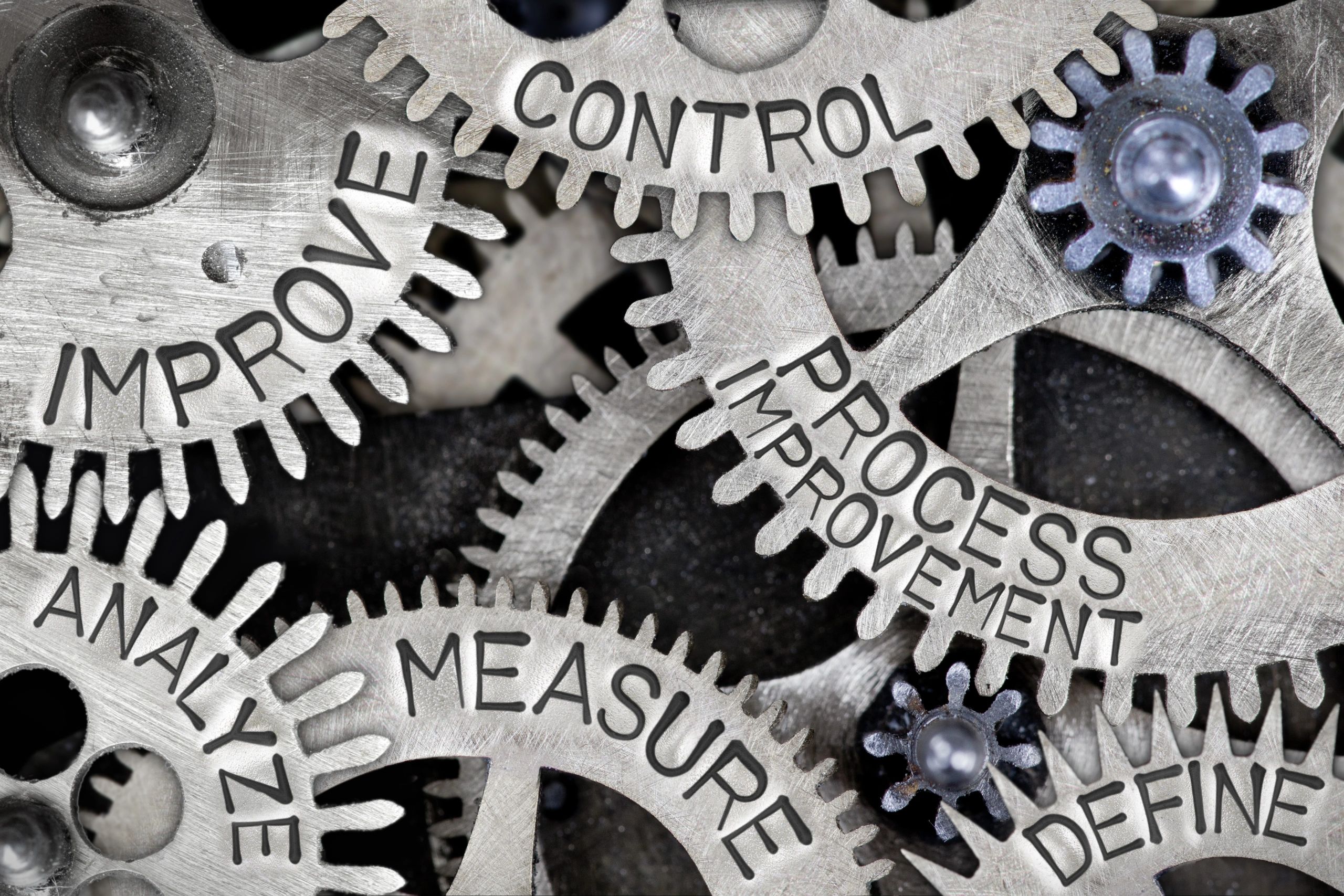 Process improvement concept shown on a mechanical gear